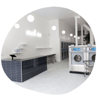 The front desk of a tidy laundromat.